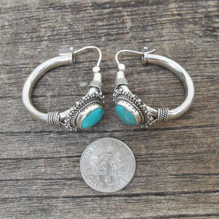 Refined sterling silver earrings adorned with turquoise