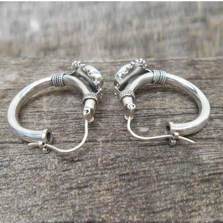 Elegant sterling silver earrings adorned with handcrafted turquoise