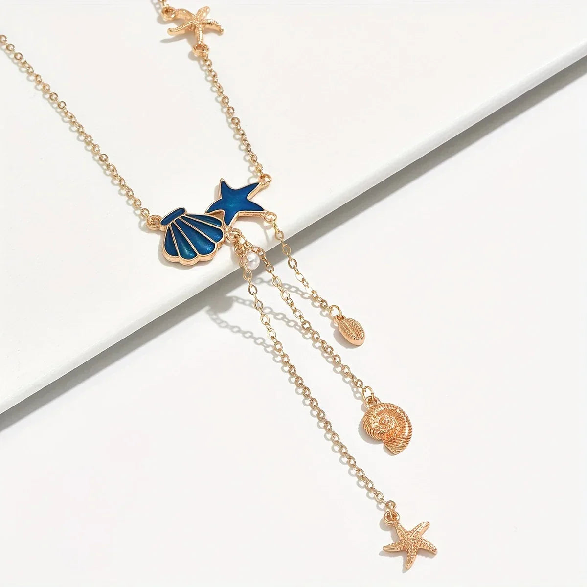 Elegant Gold Necklace with Star and Blue Shell