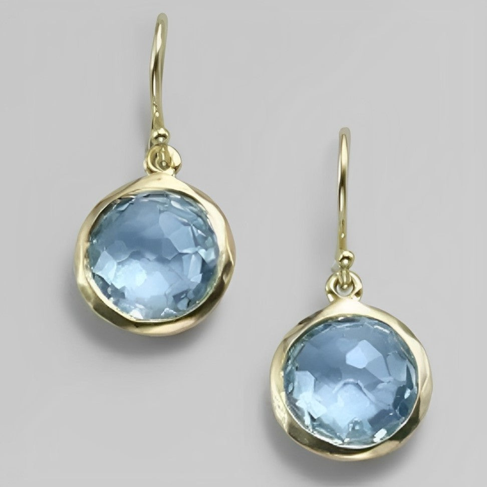 Elegant Earrings Adorned with a Striking Blue Crystal