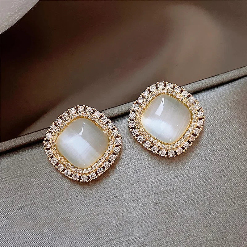 Elegant square earrings adorned with opal and cubic zirconia