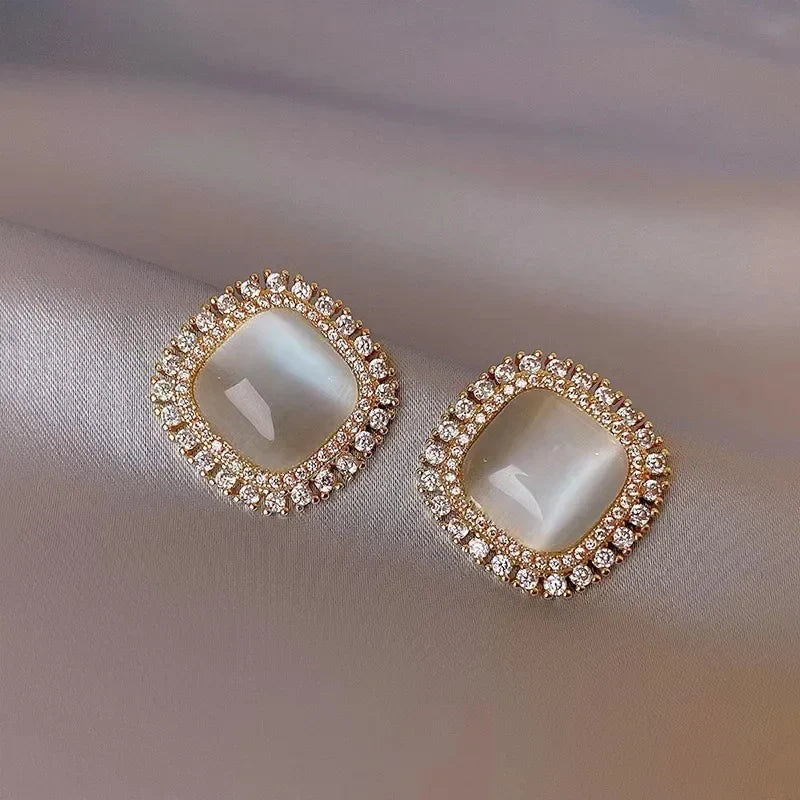 Elegant square earrings adorned with opal and cubic zirconia