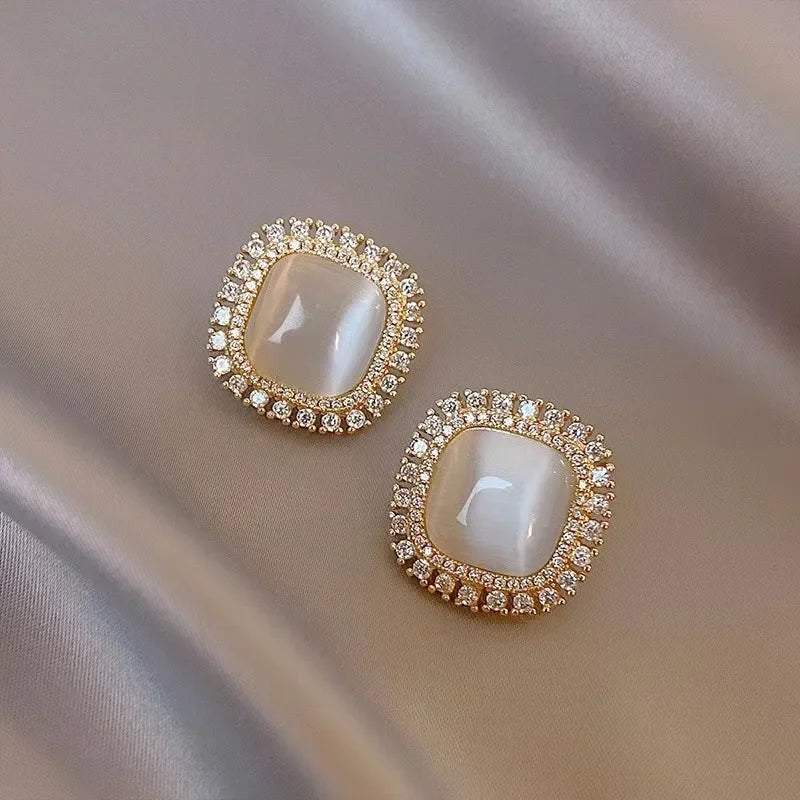 Elegant square earrings adorned with opal and cubic zirconia