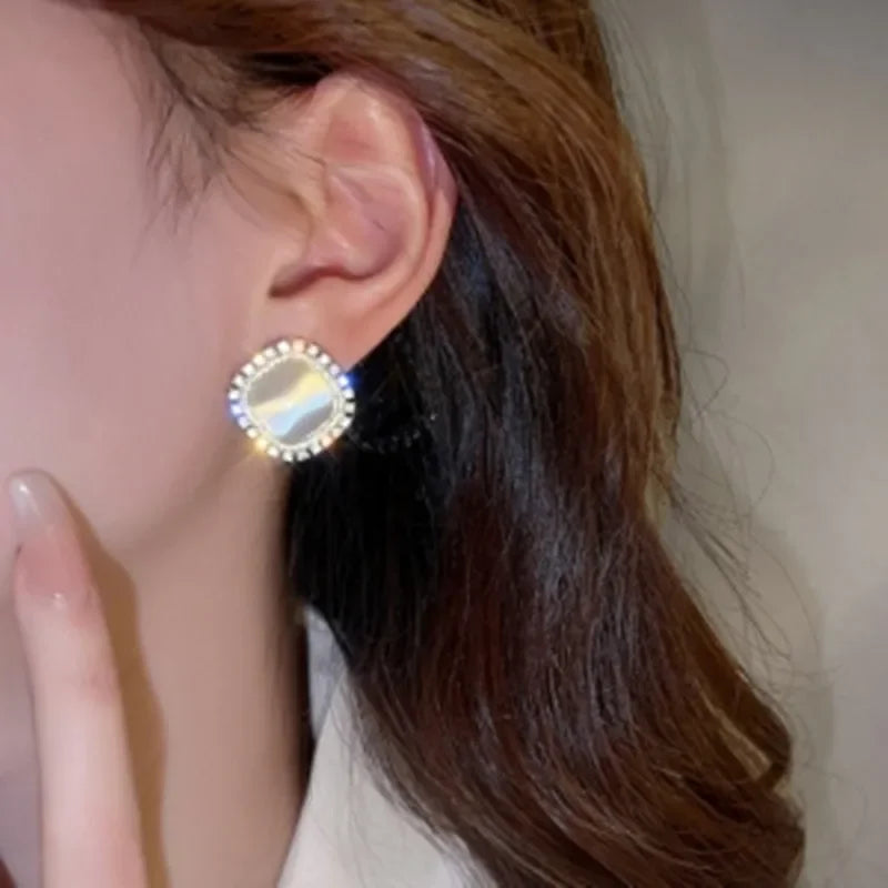 Elegant square earrings adorned with opal and cubic zirconia