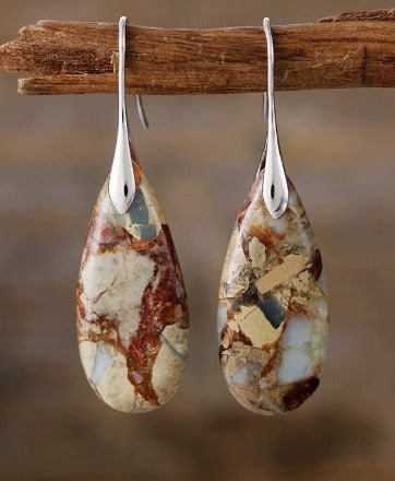 Elegant Earrings Adorned with an Oval Stone