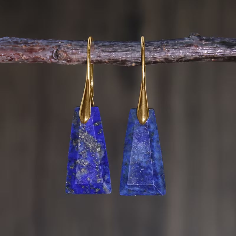 Deep-blue tapered geometric earrings with long gold-tone hooks.