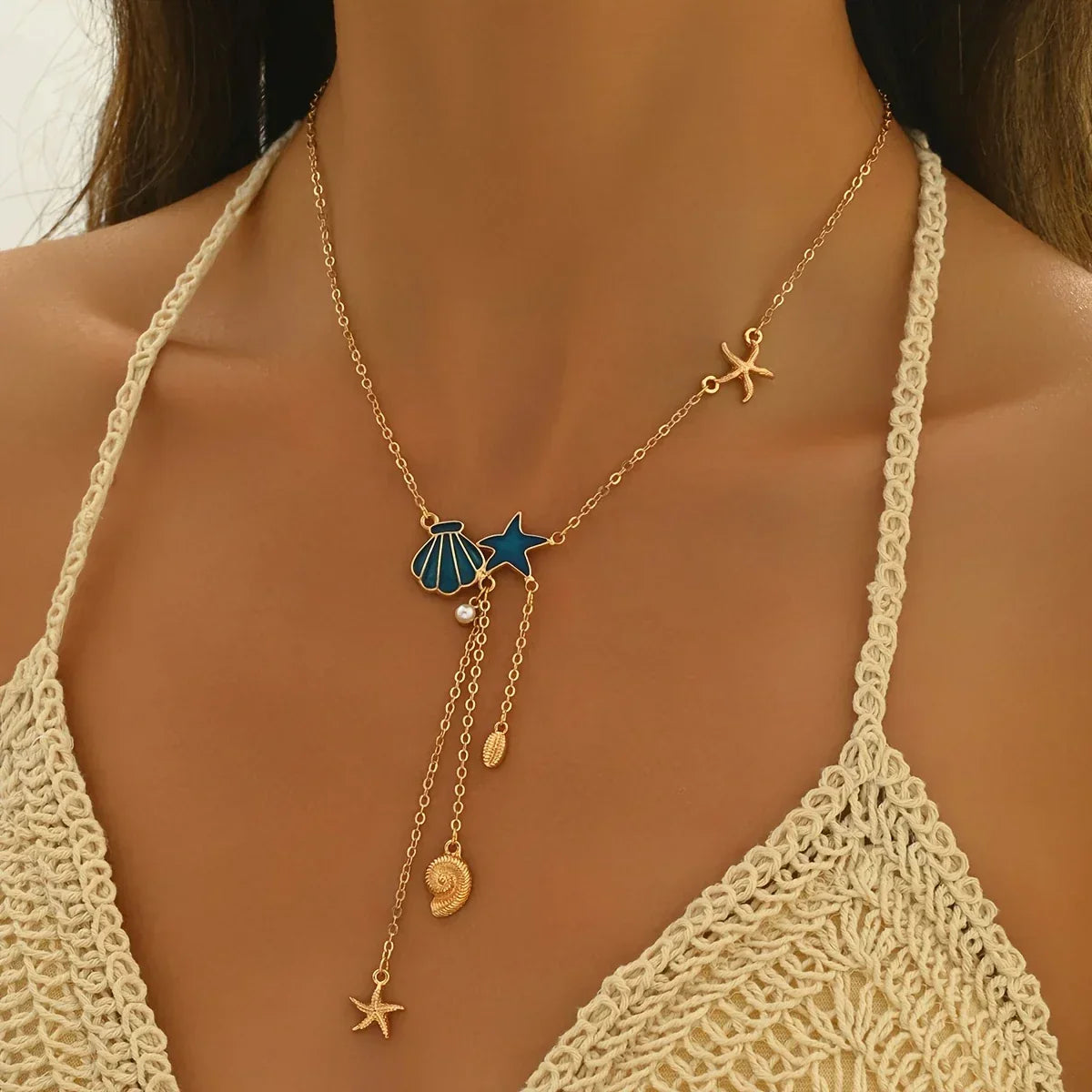 Elegant Gold Necklace with Star and Blue Shell