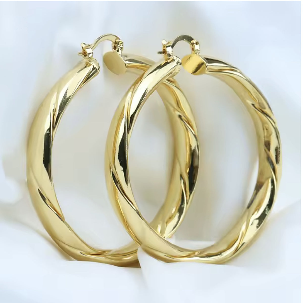 Twisted gold tube hoop earrings