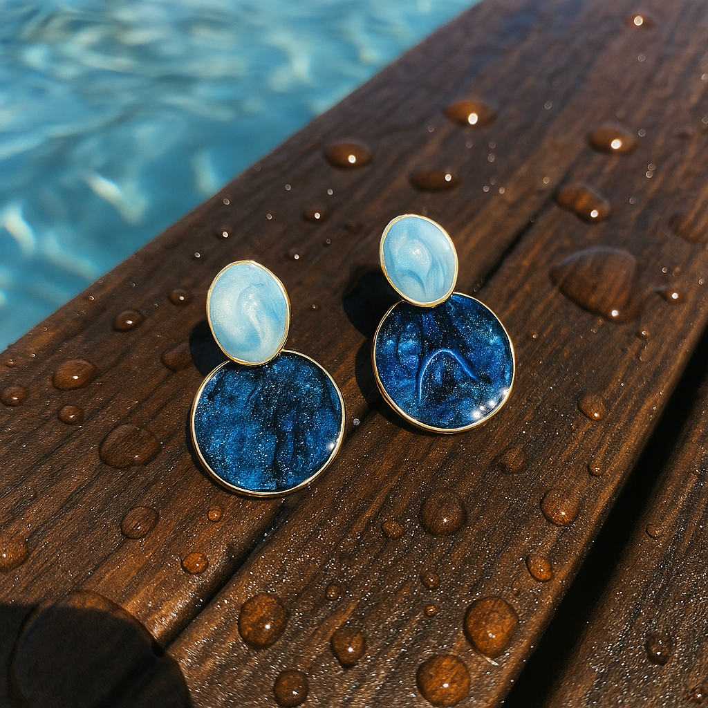 Nerissa blue round drop earrings on a wooden surface