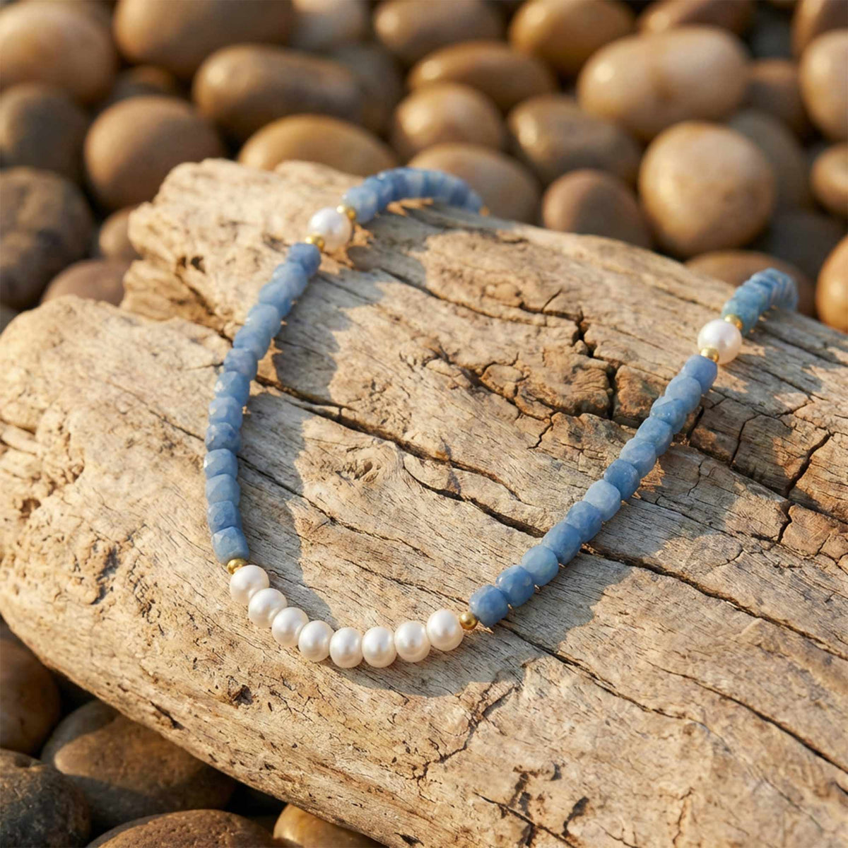 Icy blue beaded necklace with a row of round white beads along the front.