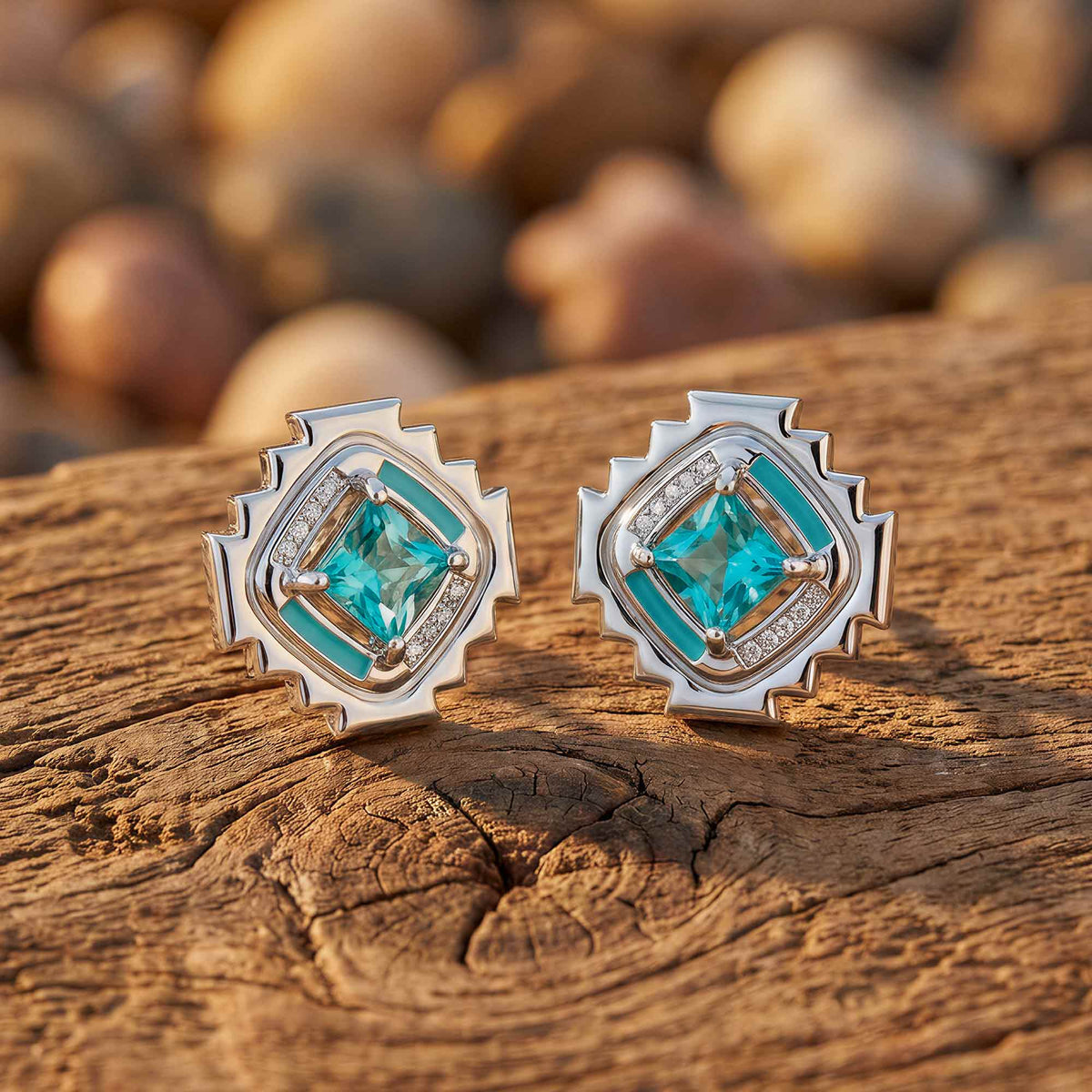 Square icy blue stud earrings with stepped silver-tone borders, clear accents, and narrow aqua sections.