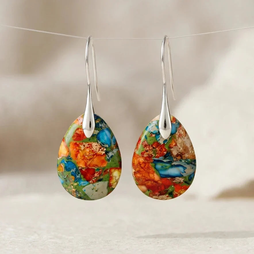 Multicolor mosaic teardrop earrings with long tapered silver-tone hooks.