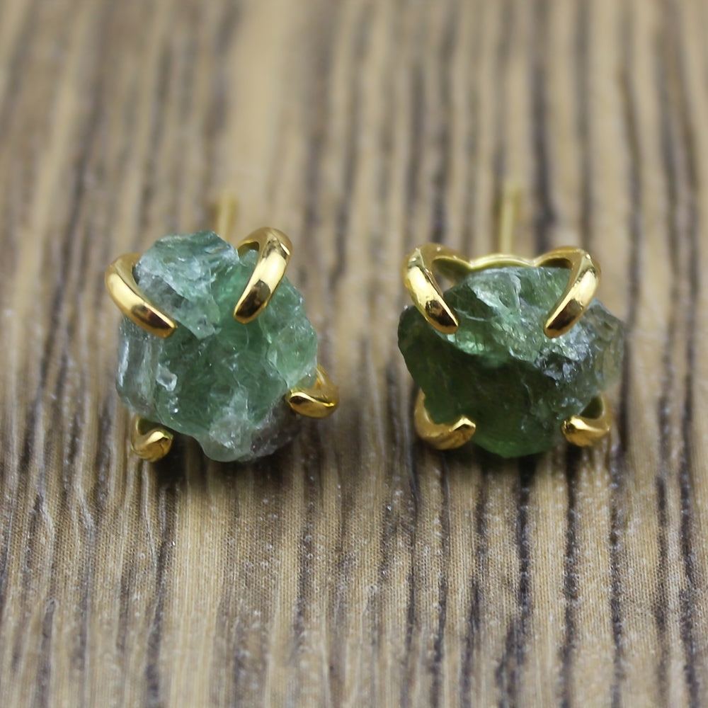 Green irregular textured stud earrings held by gold-tone claw settings.