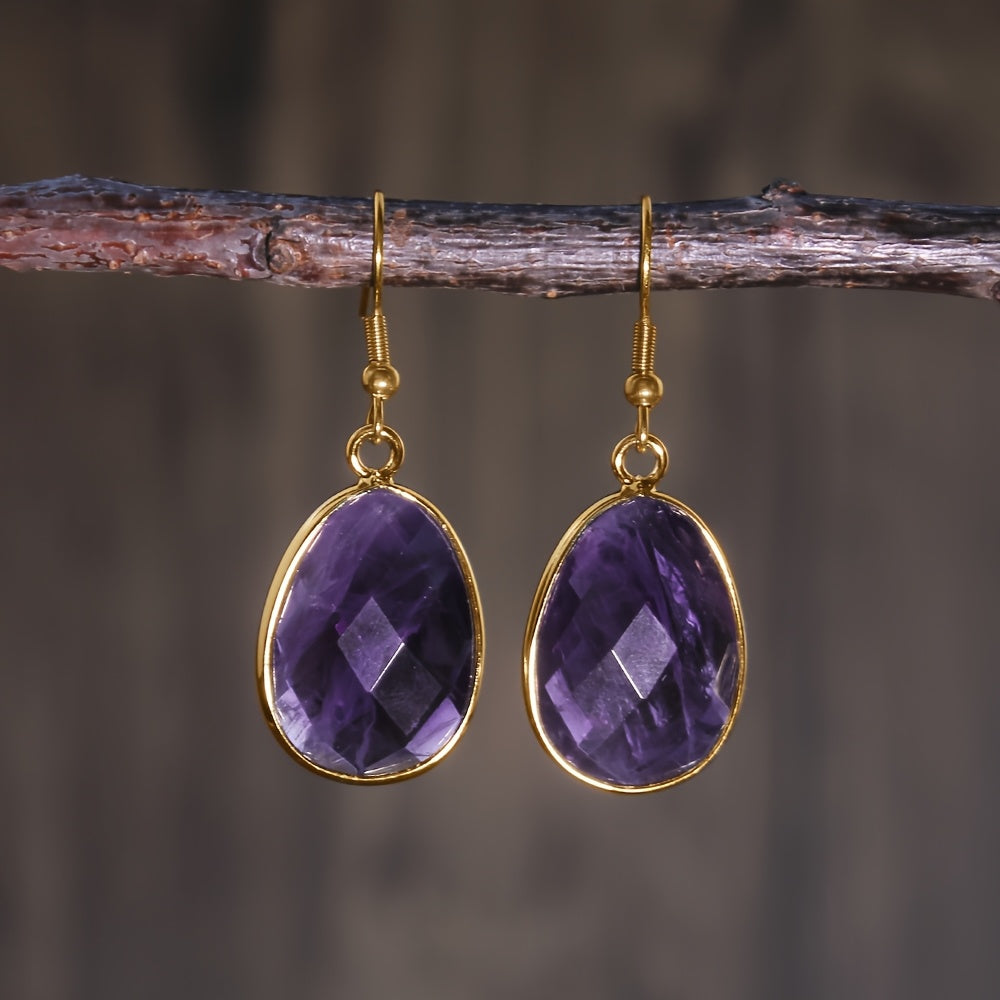 Faceted purple teardrop earrings in slim gold-tone rims with hooks.