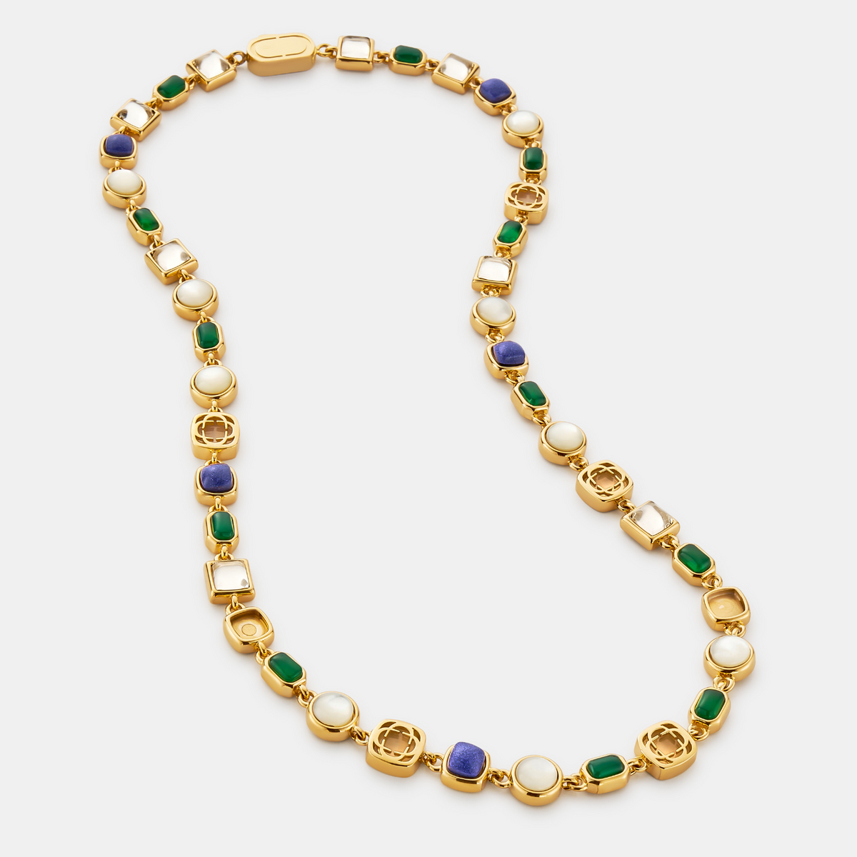 Gold-tone link necklace with blue and green rectangular accents, pale circles, and decorative metallic shapes.