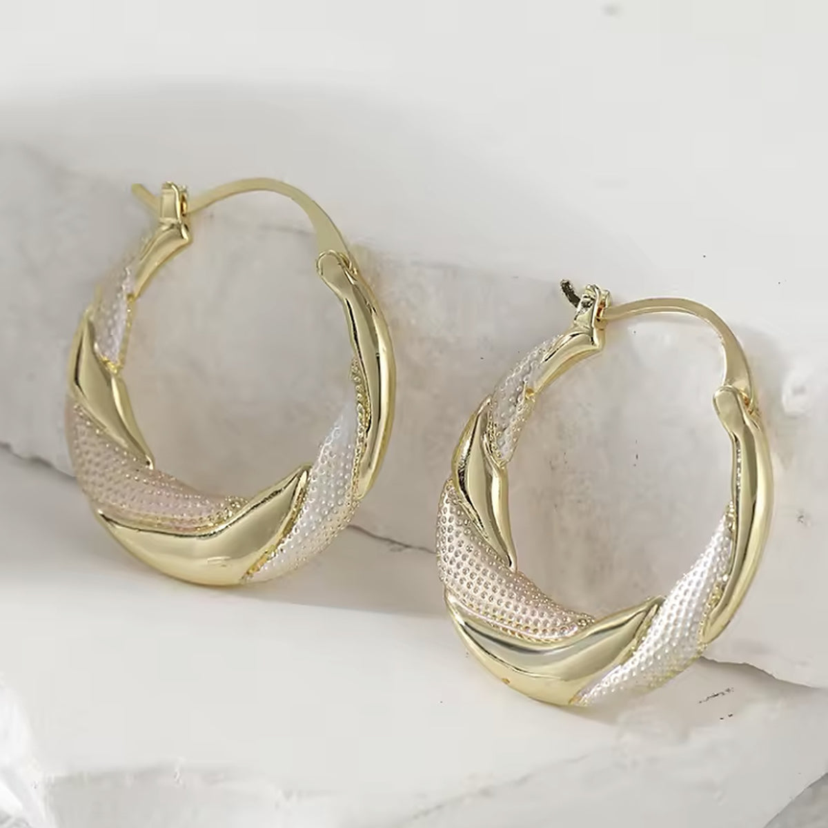 Two-tone textured crescent hoop earrings