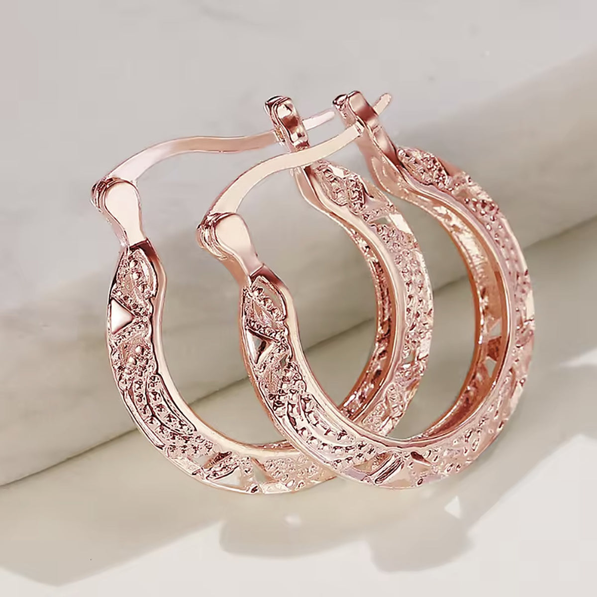 Filigree hoop earrings in rose gold